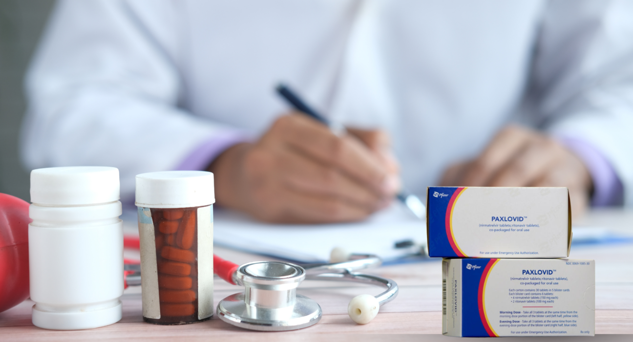 "Paxlovid rebound treatment — Paxlovid tablets, pill bottles, and stethoscope on doctor's desk with prescription being written"